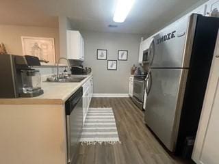 726 Lookover Dr Unit 726, Anderson, SC 29621 - kitchen featuring stainless steel appliances, a sink, dark wood-style floors, baseboards, and light countertops