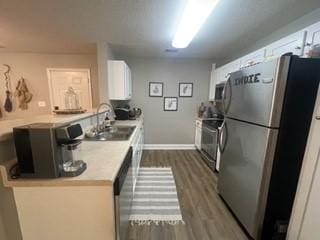 726 Lookover Dr Unit 726, Anderson, SC 29621 - kitchen with freestanding refrigerator, a sink, range, dark wood-type flooring, and light countertops