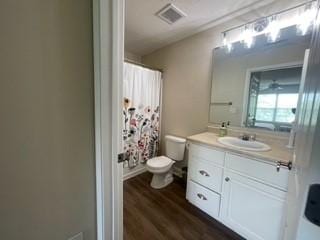 726 Lookover Dr Unit 726, Anderson, SC 29621 - full bath with toilet, vanity, wood finished floors, and a shower with shower curtain