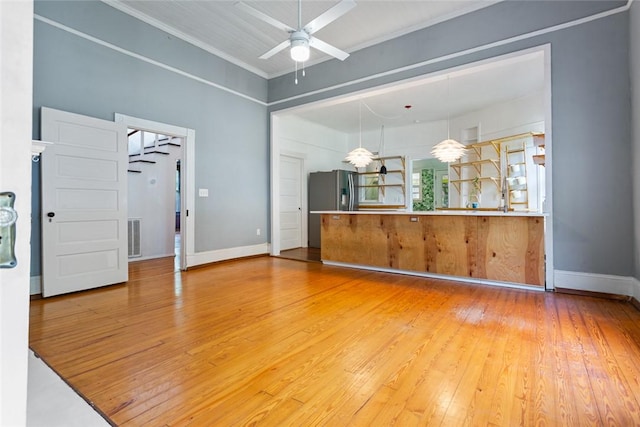 300 S Fairplay St, Seneca, SC 29678 - unfurnished living room featuring ceiling fan, hardwood / wood-style floors, and baseboards