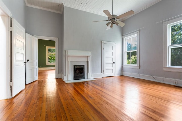 300 S Fairplay St, Seneca, SC 29678 - unfurnished living room with hardwood / wood-style floors, crown molding, a fireplace, ceiling fan, and baseboards
