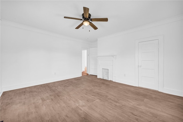 731 E Main St, Seneca, SC 29678 - unfurnished living room with crown molding, a ceiling fan, wood finished floors, a fireplace, and baseboards
