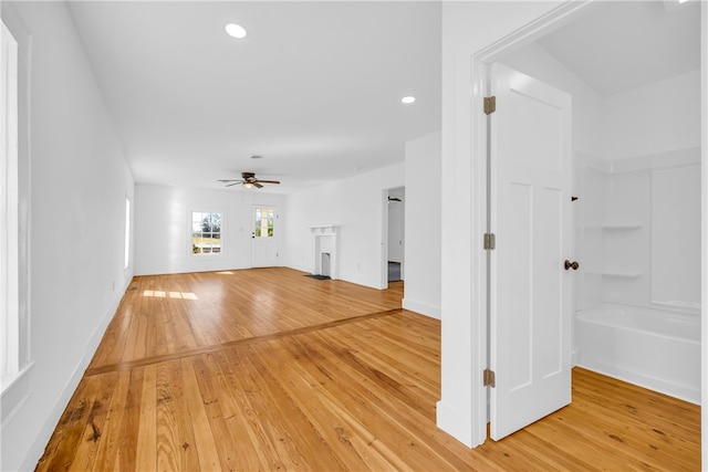 731 E Main St, Seneca, SC 29678 - unfurnished living room featuring light wood-style floors, ceiling fan, recessed lighting, and a fireplace