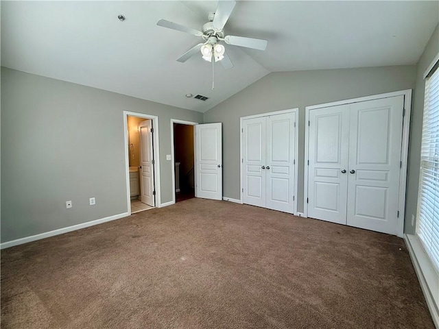 833 Old Greenville Hwy Unit 323, Clemson, SC 29631 - unfurnished bedroom with carpet floors, two closets, vaulted ceiling, baseboards, and multiple windows
