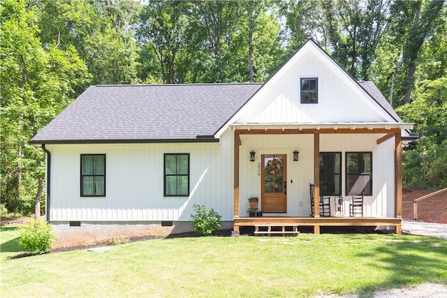 226 Edgewood Dr, Seneca, SC 29678 - modern farmhouse style home with roof with shingles, a front lawn, and a porch
