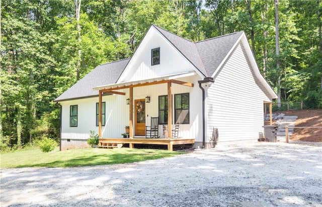 226 Edgewood Dr, Seneca, SC 29678 - modern farmhouse style home with a porch, a shingled roof, view of wooded area, and crawl space