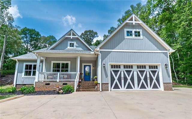 1019 Glen Rd, Seneca, SC 29672 - craftsman-style home featuring covered porch, driveway, a garage, and roof with shingles