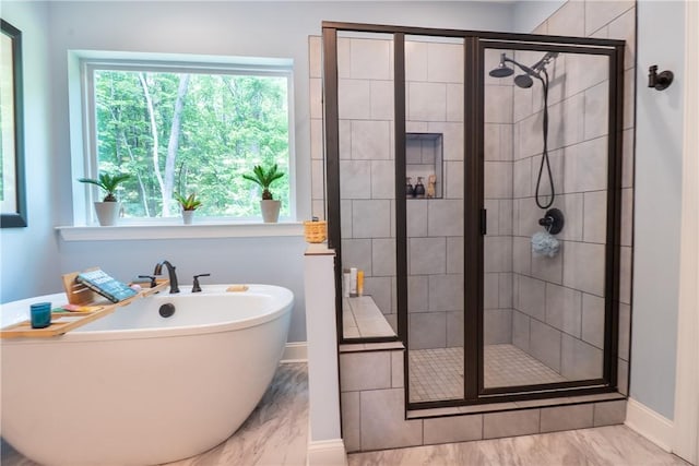 1019 Glen Rd, Seneca, SC 29672 - full bathroom with a freestanding tub, baseboards, a stall shower, and plenty of natural light