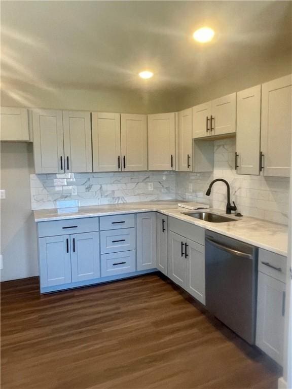 403 E S 5th St, Seneca, SC 29678 - kitchen with stainless steel dishwasher, a sink, tasteful backsplash, light countertops, and dark wood-type flooring