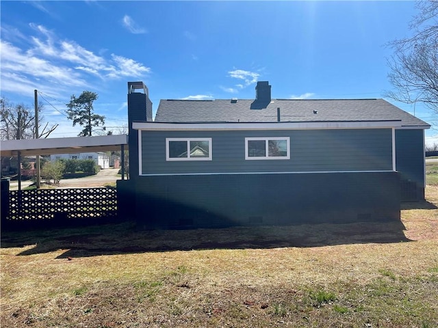 403 E S 5th St, Seneca, SC 29678 - rear view of house with a chimney, a lawn, and a carport