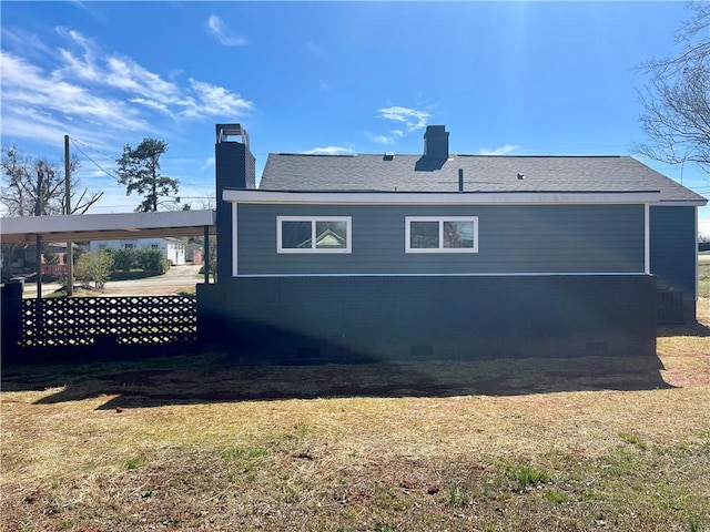 403 E S 5th St, Seneca, SC 29678 - back of house featuring a chimney, a lawn, and a shingled roof