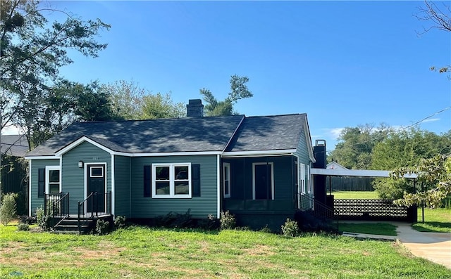 403 E S 5th St, Seneca, SC 29678 - view of front of house featuring a chimney, a front yard, and a shingled roof