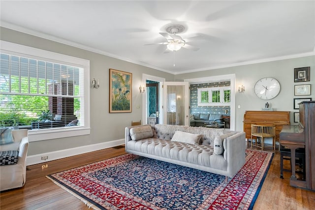 227 S Main St, Honea Path, SC 29654 - living room featuring ceiling fan, crown molding, wood finished floors, and baseboards