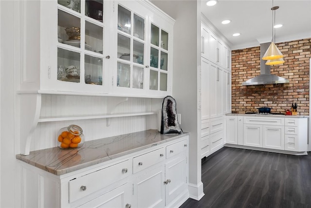 227 S Main St, Honea Path, SC 29654 - kitchen featuring wall chimney range hood, white cabinetry, light stone countertops, pendant lighting, and recessed lighting