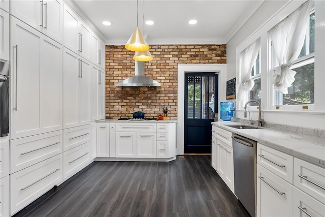 227 S Main St, Honea Path, SC 29654 - kitchen with stainless steel dishwasher, a sink, crown molding, white cabinets, and wall chimney exhaust hood