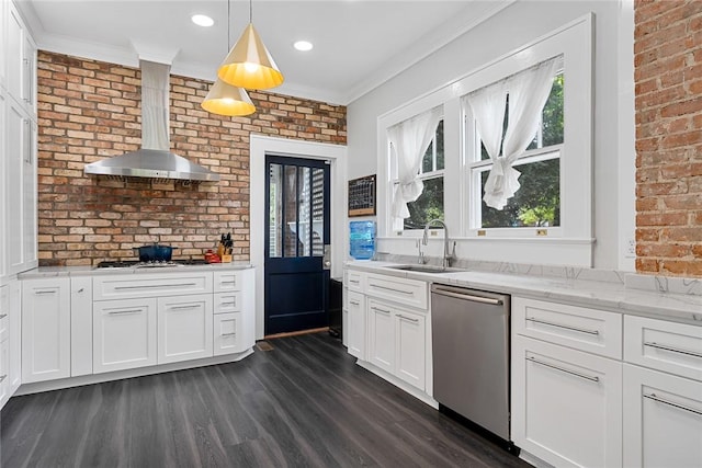 227 S Main St, Honea Path, SC 29654 - kitchen featuring stainless steel appliances, wall chimney range hood, brick wall, a sink, and dark wood-type flooring