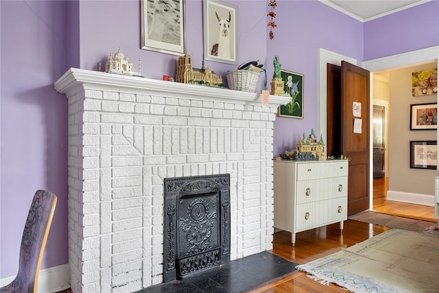 227 S Main St, Honea Path, SC 29654 - detailed view of wood finished floors, a fireplace, and baseboards