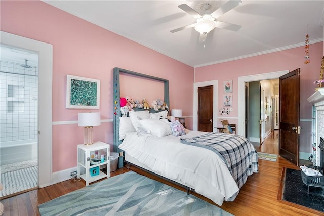 227 S Main St, Honea Path, SC 29654 - bedroom featuring wood finished floors, ornamental molding, ensuite bath, a ceiling fan, and baseboards