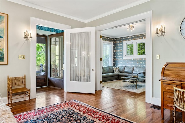 227 S Main St, Honea Path, SC 29654 - entryway with wood finished floors, wallpapered walls, crown molding, and baseboards