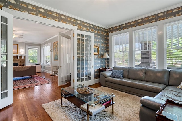 227 S Main St, Honea Path, SC 29654 - living area featuring wallpapered walls, crown molding, wood-type flooring, a ceiling fan, and baseboards