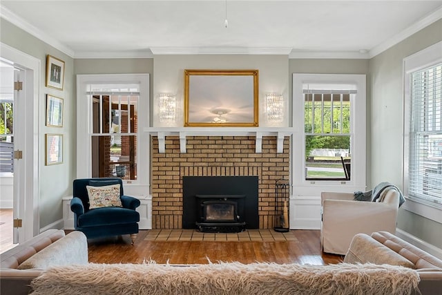 227 S Main St, Honea Path, SC 29654 - living room with wood finished floors, ornamental molding, a fireplace, and baseboards