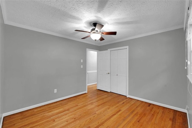 133 Cherokee Rd, Easley, SC 29642 - unfurnished bedroom with light wood-style floors, baseboards, a textured ceiling, a closet, and a ceiling fan