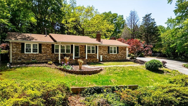 133 Cherokee Rd, Easley, SC 29642 - single story home with a chimney, a front yard, crawl space, and brick siding