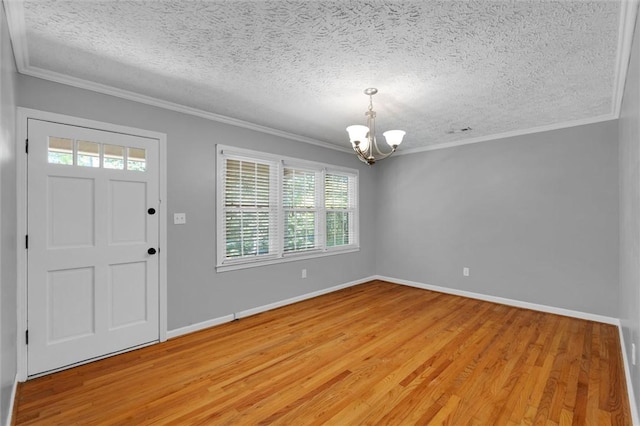 133 Cherokee Rd, Easley, SC 29642 - entryway with a chandelier, a textured ceiling, light wood-type flooring, ornamental molding, and baseboards