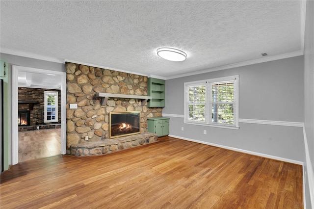 133 Cherokee Rd, Easley, SC 29642 - unfurnished living room with a fireplace, wood finished floors, crown molding, baseboards, and a textured ceiling