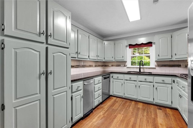 133 Cherokee Rd, Easley, SC 29642 - kitchen featuring a sink, dark countertops, tasteful backsplash, and crown molding