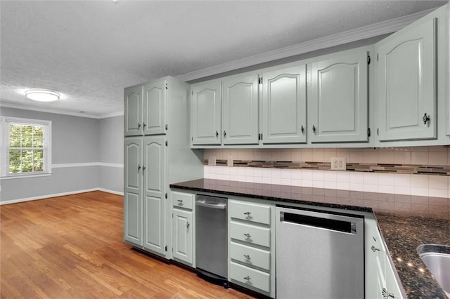 133 Cherokee Rd, Easley, SC 29642 - kitchen with stainless steel dishwasher, a textured ceiling, decorative backsplash, light wood-style flooring, and baseboards