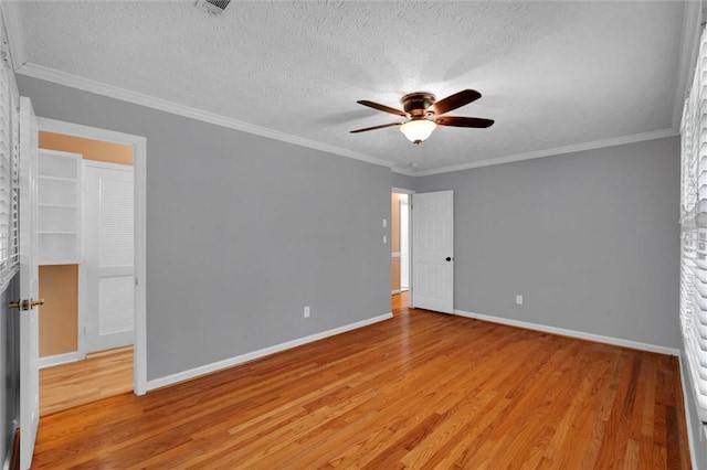 133 Cherokee Rd, Easley, SC 29642 - unfurnished bedroom with light wood-style flooring, a textured ceiling, baseboards, ornamental molding, and ceiling fan