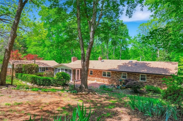 133 Cherokee Rd, Easley, SC 29642 - rear view of house with a chimney and a sunroom