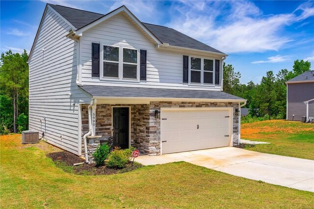 5990 Old Pearman Dairy Rd, Anderson, SC 29625 - view of front of property featuring an attached garage, a front yard, central AC unit, and stone siding
