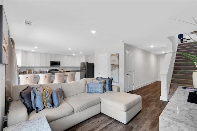 5990 Old Pearman Dairy Rd, Anderson, SC 29625 - living room featuring stairs, dark wood finished floors, recessed lighting, and baseboards