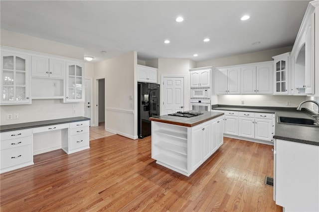 118 Pinnacle Pointe Dr, Seneca, SC 29672 - kitchen featuring open shelves, white appliances, a sink, dark countertops, and white cabinets