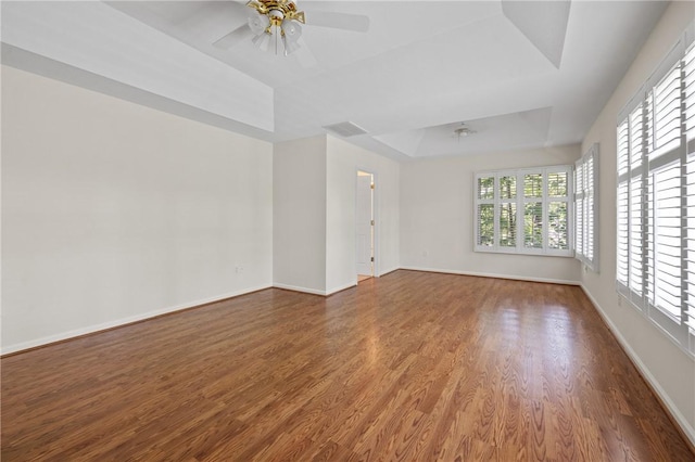 118 Pinnacle Pointe Dr, Seneca, SC 29672 - empty room featuring a ceiling fan, a raised ceiling, wood finished floors, and baseboards