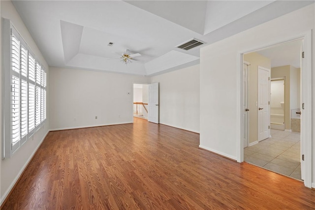118 Pinnacle Pointe Dr, Seneca, SC 29672 - unfurnished room featuring ceiling fan, a tray ceiling, wood finished floors, and baseboards