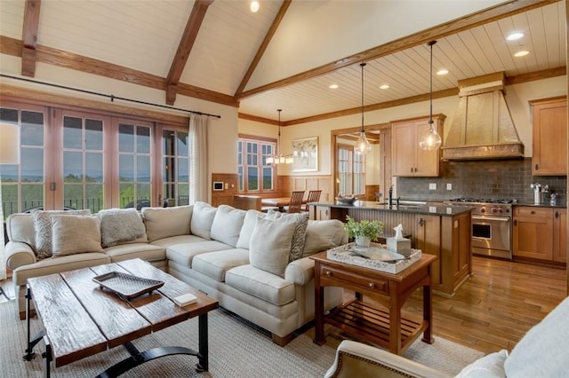 143 Button Bush Trl, Six Mile, SC 29682 - living area with light wood finished floors, recessed lighting, wood ceiling with exposed beams, a wainscoted wall, and high vaulted ceiling
