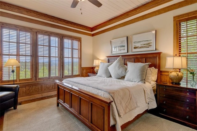143 Button Bush Trl, Six Mile, SC 29682 - bedroom with multiple windows, a wainscoted wall, wood walls, light colored carpet, and ceiling fan