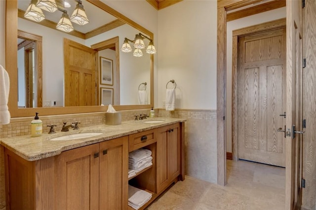 143 Button Bush Trl, Six Mile, SC 29682 - bathroom with double vanity, tile walls, and a wainscoted wall