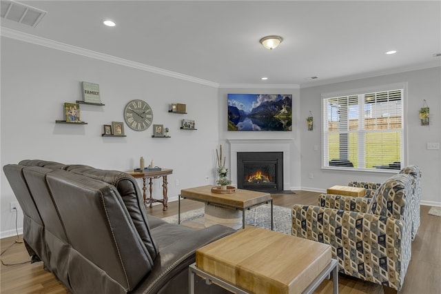 400 N Oak Crest Dr, Belton, SC 29627 - living area with crown molding, a fireplace with flush hearth, wood finished floors, baseboards, and recessed lighting