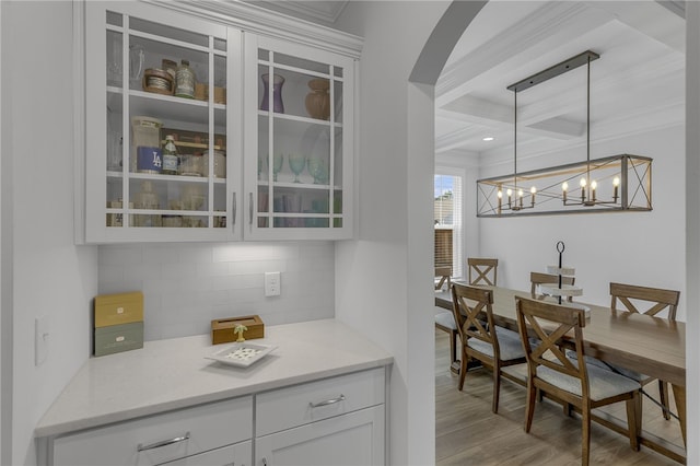 400 N Oak Crest Dr, Belton, SC 29627 - bar area featuring ornamental molding, tasteful backsplash, wood finished floors, beam ceiling, and hanging light fixtures
