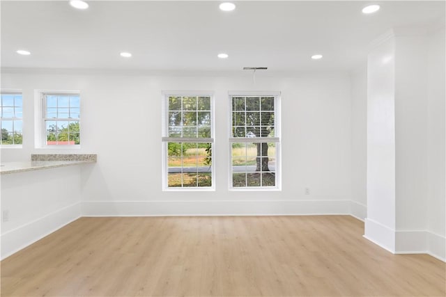 701 S Townville St, Seneca, SC 29678 - empty room with crown molding, baseboards, healthy amount of natural light, light wood-style flooring, and recessed lighting