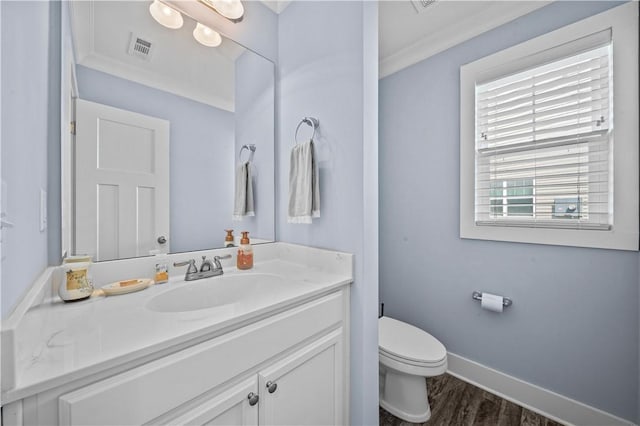 406 Bee Cove Way, Pendleton, SC 29670 - bathroom featuring vanity, toilet, wood finished floors, ornamental molding, and baseboards