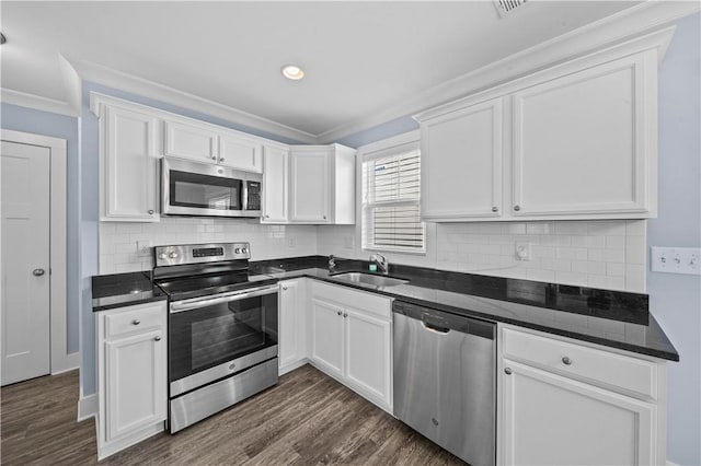 406 Bee Cove Way, Pendleton, SC 29670 - kitchen featuring stainless steel appliances, white cabinets, crown molding, dark wood finished floors, and recessed lighting