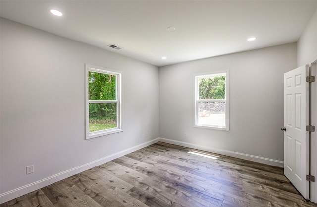 107A Avondale Rd, Anderson, SC 29624 - empty room featuring healthy amount of natural light, wood finished floors, baseboards, and recessed lighting