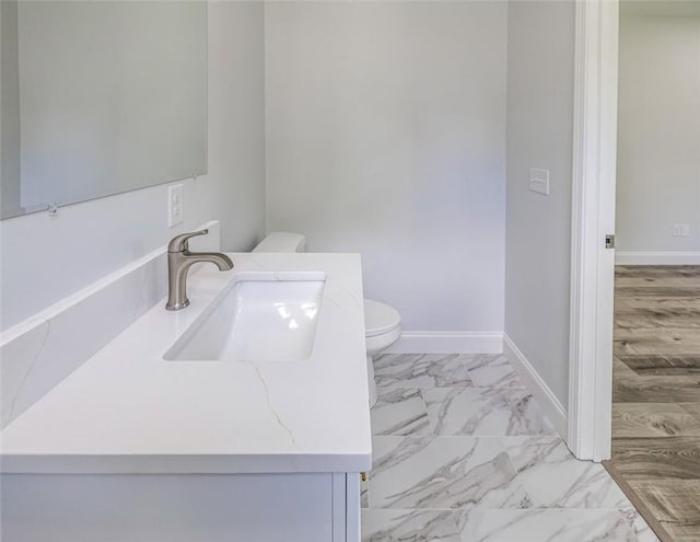 107A Avondale Rd, Anderson, SC 29624 - bathroom featuring toilet, marble finish flooring, vanity, and baseboards