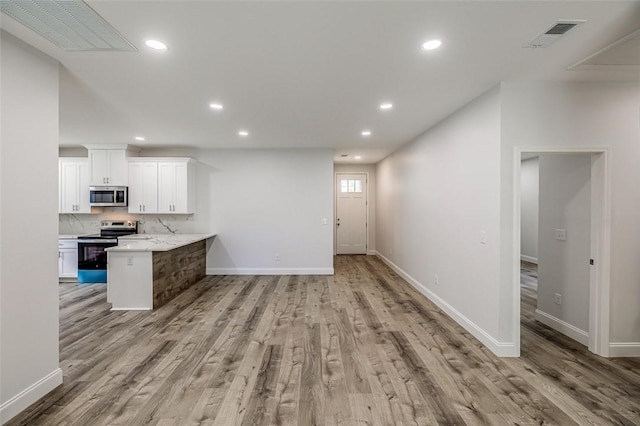107A Avondale Rd, Anderson, SC 29624 - kitchen with appliances with stainless steel finishes, white cabinets, light wood finished floors, baseboards, and recessed lighting