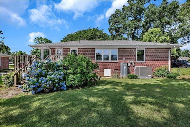 2400 Lane Ave, Anderson, SC 29621 - rear view of house with brick siding, a lawn, cooling unit, and stairs